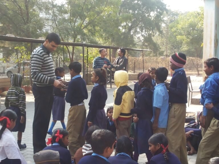 Director- Finance,Mr. Abhishek Mishra, Chair -Education,Yi Jaipur organized MID DAY MEAL for 100 students on 16th Jan.14